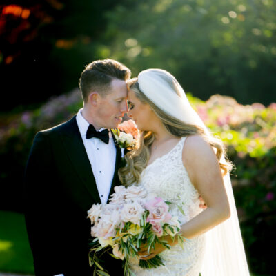 The bride and groom pose for a natural portrait in the beautiful sunlight at Hawkstone Hall