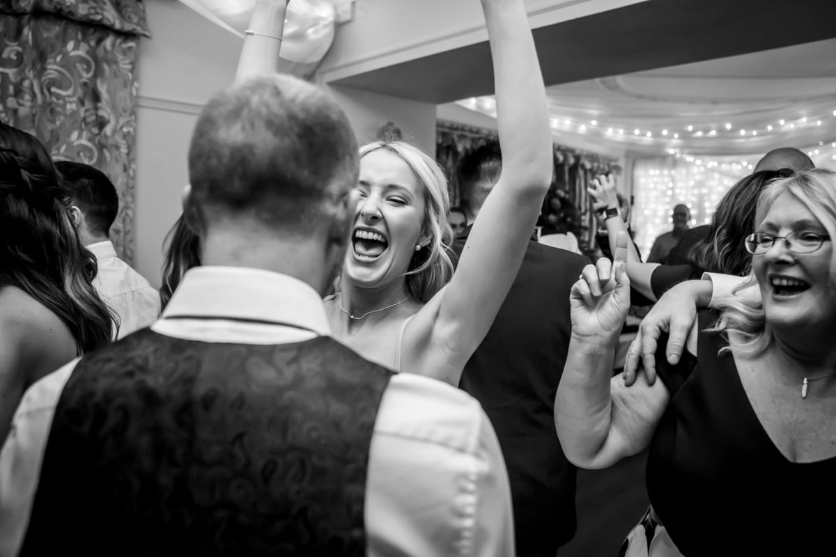 The bride cheers on the dancefloor