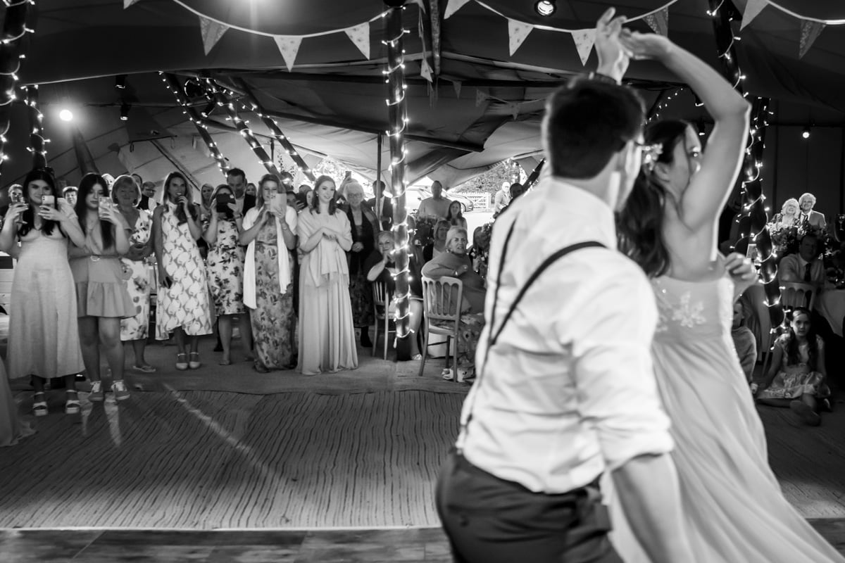The bride and groom share their first dance tipi wedding photography