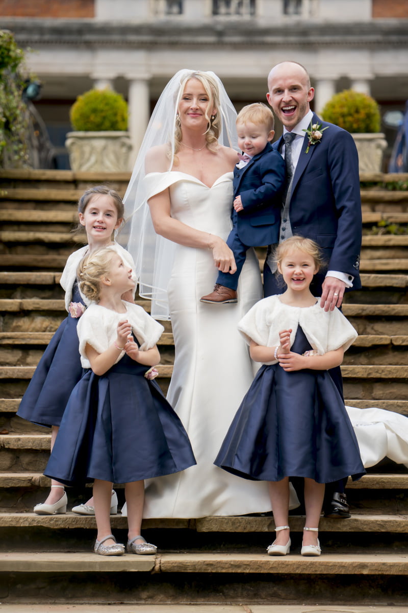 A gorgeous portrait of the bride and groom with their children