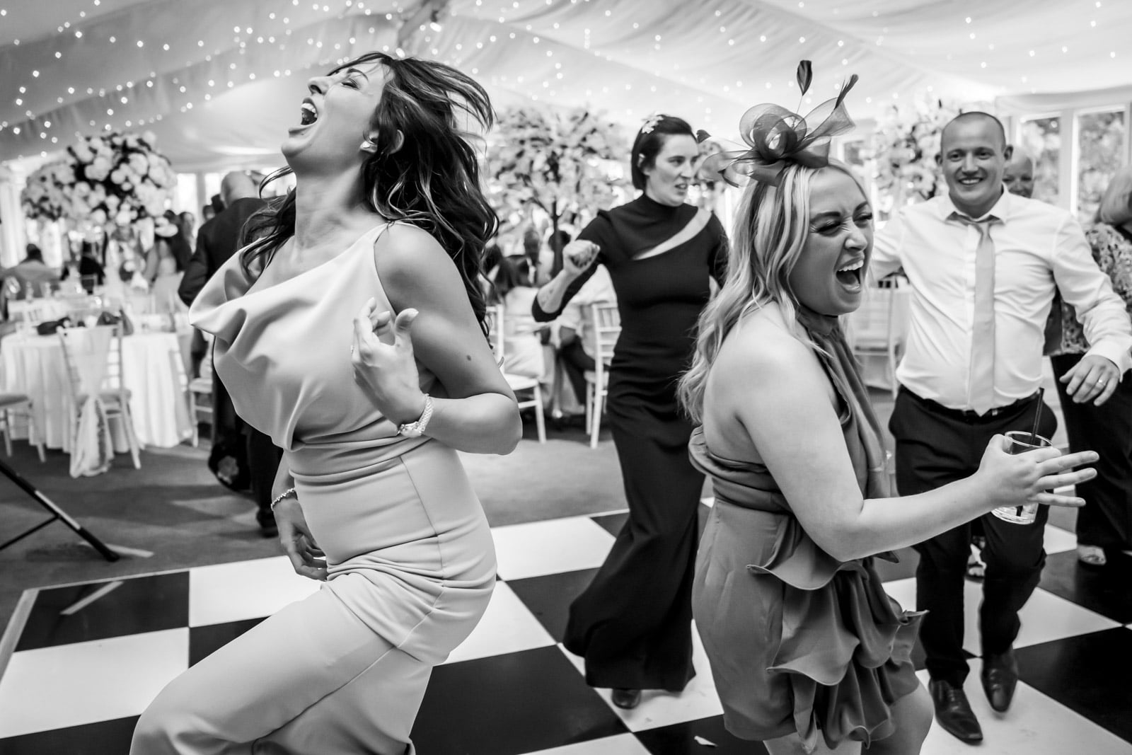 The wedding guests have a brilliant time on the dancefloor natural wedding photography