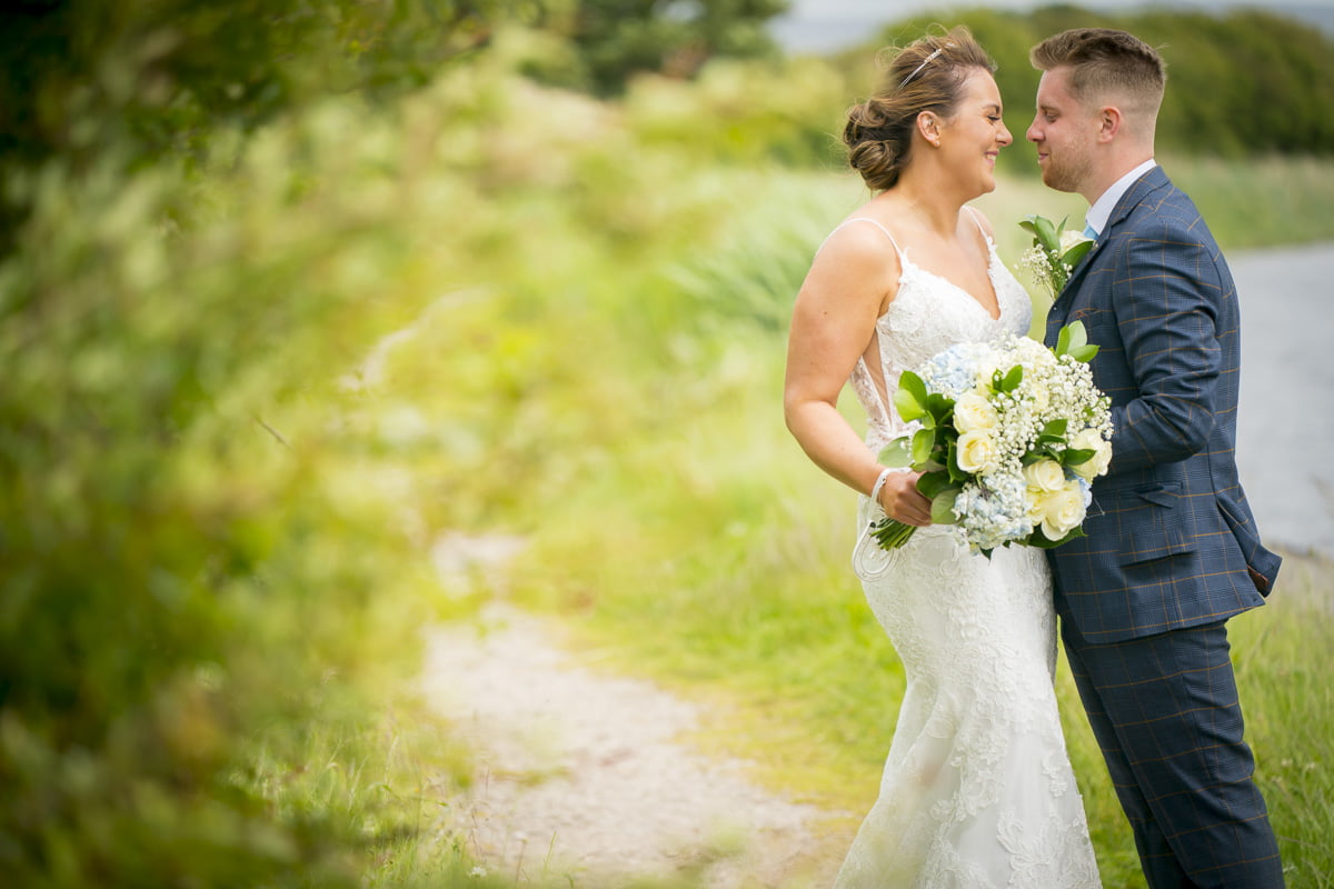 A natural portrait of the bride and groom in the countryside